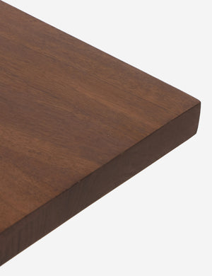 Close up view of the corner of the Mannion modern square leg dining table.