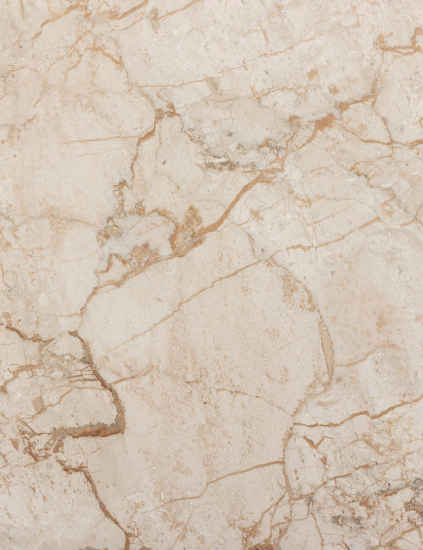 #color::cream-marble | Close up of the stone of the Engen round modern marble side table.