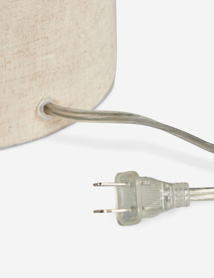 Close up of the cord of the Solstice monochromatic linen column table lamp.