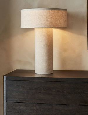 Solstice monochromatic linen column table lamp styled on a dresser.