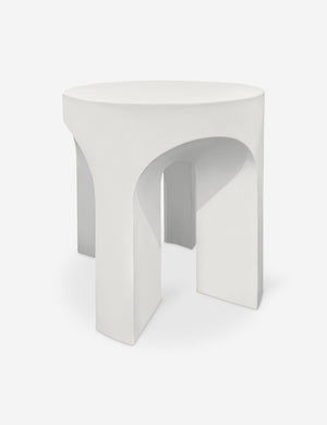 Elston round sculptural concrete side table.