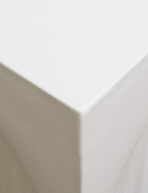 Close up view of the corner of the Manzano square modern concrete side table.