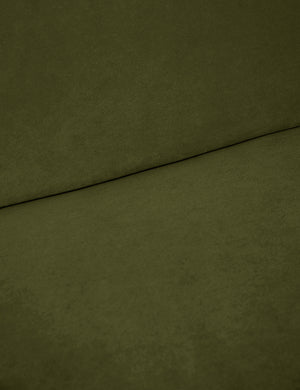 Where the back and seat of the Lena Cognac Velvet armless sofa meet