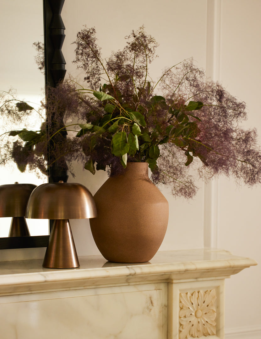 #color::antique-brass #size::mini | Monochromatic Wembley Cordless Mini Table Lamp styled on a mantel next to a vase