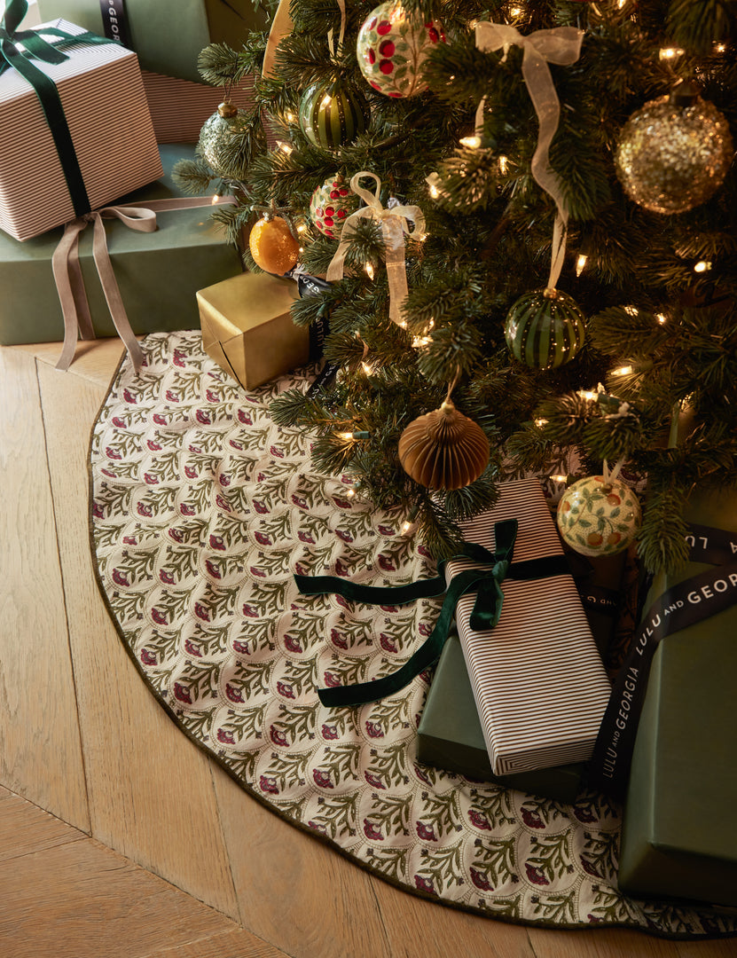 #color::red | Christmas tree with presents on the Dov floral pattern tree skirt