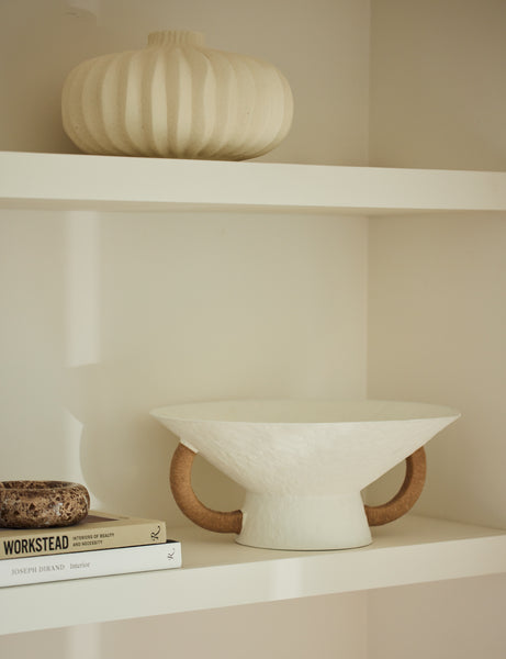 #color::white | Olea modern decorative pedestal bowl styled on a shelf.