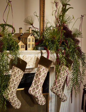 Three Dove floral pattern stocking hanging on a mantel