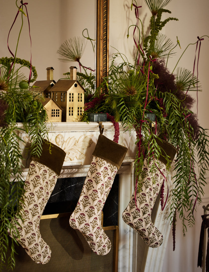 #color::red | Three Dove floral pattern stocking hanging on a mantel