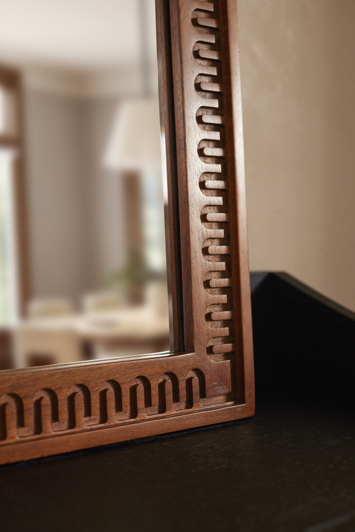 #color::natural | Close up bottom corner view of the Dane carved wood framed mirror