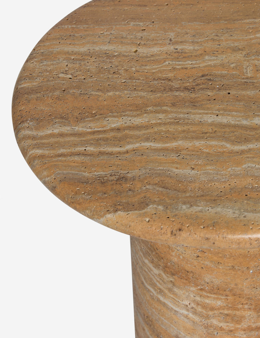 #color::faux-canyon-travertine | Close up of the Mona round stone drink table.