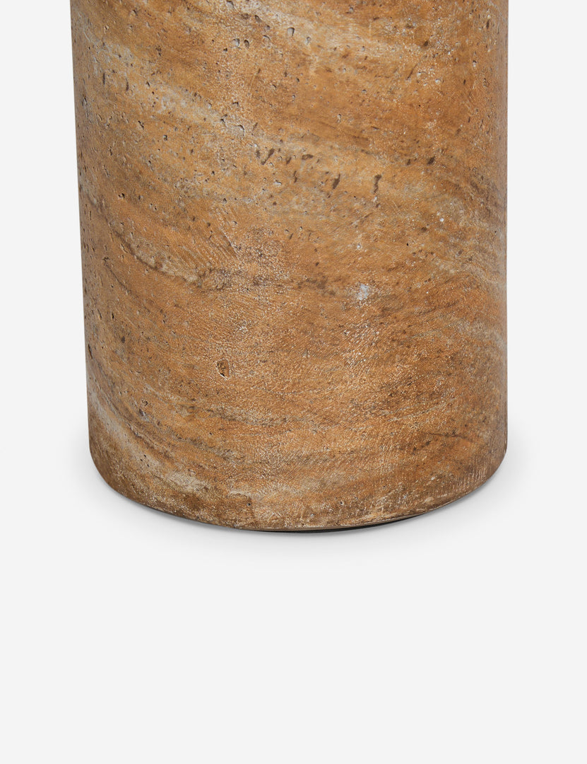 #color::faux-canyon-travertine | Close up of the Mona round stone drink table.