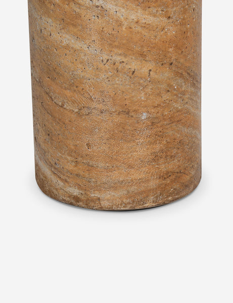 #color::faux-canyon-travertine | Close up of the Mona round stone drink table.