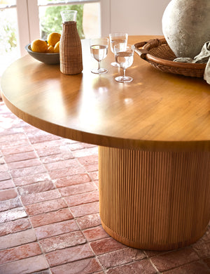 Elvia round rattan stacked leg dining table