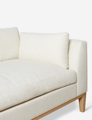 Inner corner of the Charleston ivory left-facing sectional sofa