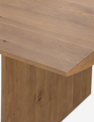 Close up of the top corner of the Remwald sculptural oak wood rectangular dining table.