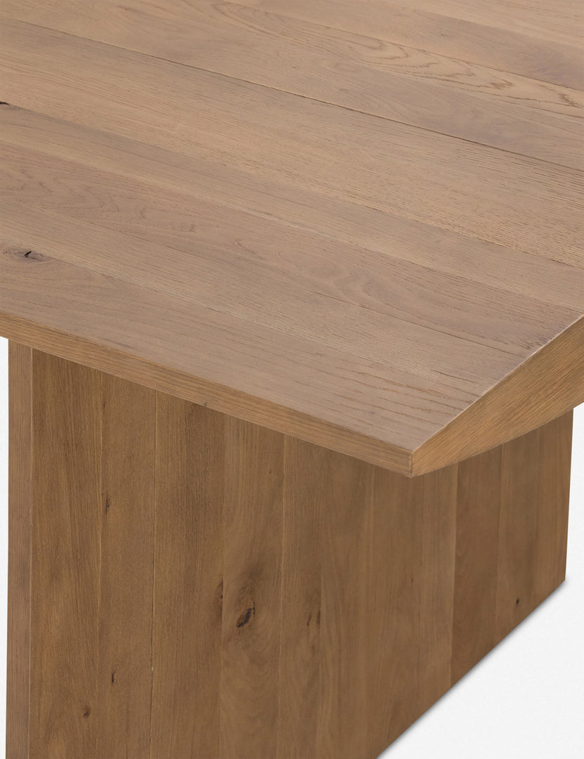 #color::natural | Close up of the top corner of the Remwald sculptural oak wood rectangular dining table.