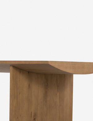 Close up of the leg of the Remwald sculptural oak wood rectangular dining table.