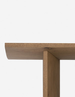 Close up of the leg of the Remwald sculptural oak wood coffee table.