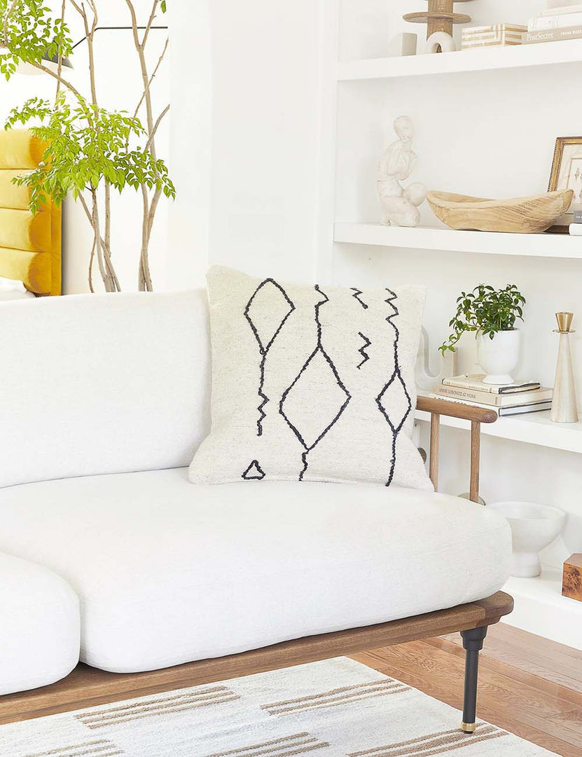 #color::black-&-natural #style::square | The moroccan black and natural beni ourain inspired square flat weave pillow by Sarah Sherman Samuel sits atop a white linen sofa