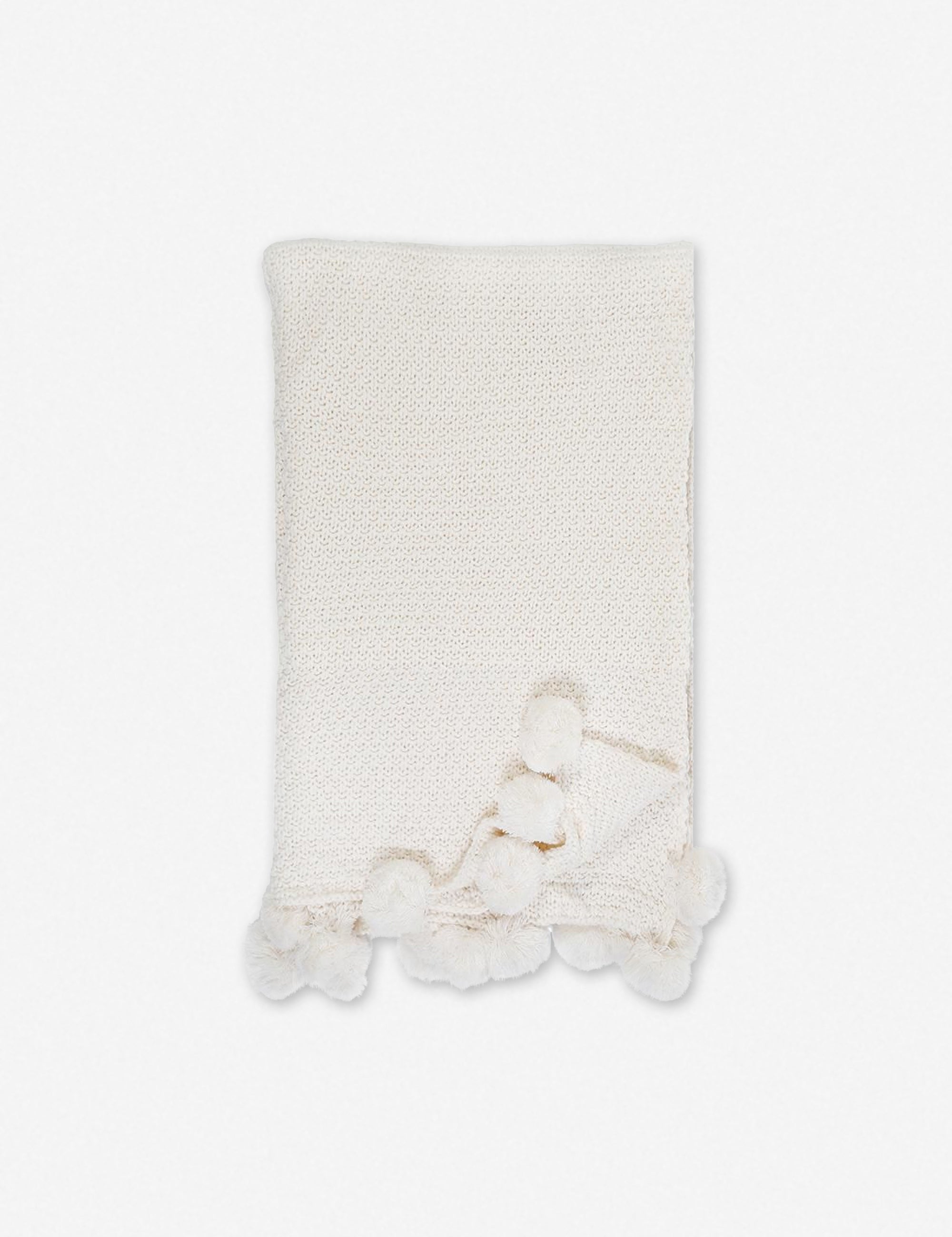 White throw with online pom poms